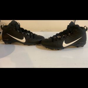 Black Nike football cleats.